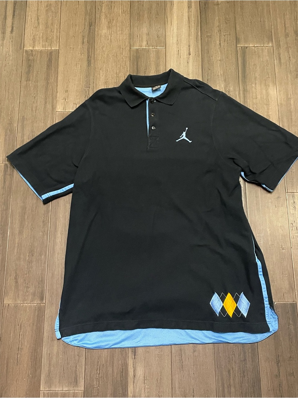 Jordan Brand 20th Anniversary golf polo in vibrant red featuring an embroidered